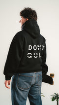 Black DON’T QUIT hoodie – back print – worn by model – Kalium